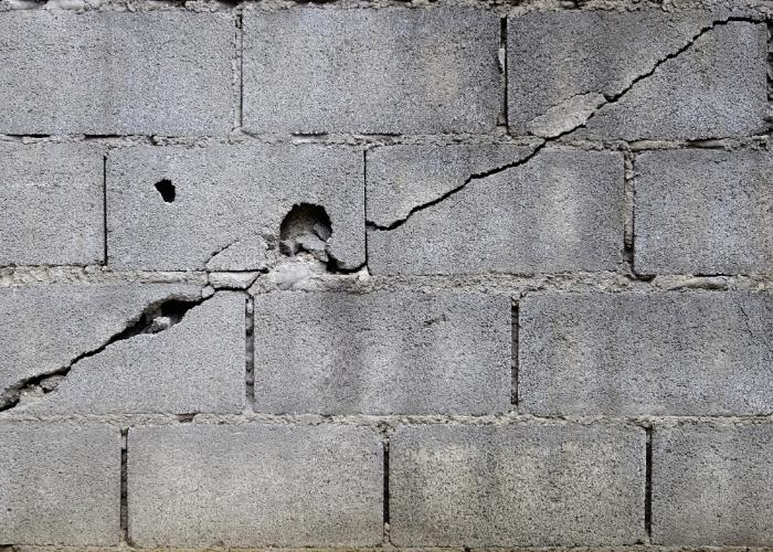 Cracked walls needing commercial foundation repair in Champaign.